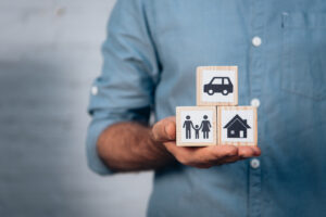 cropped view of man holding wooden cubes